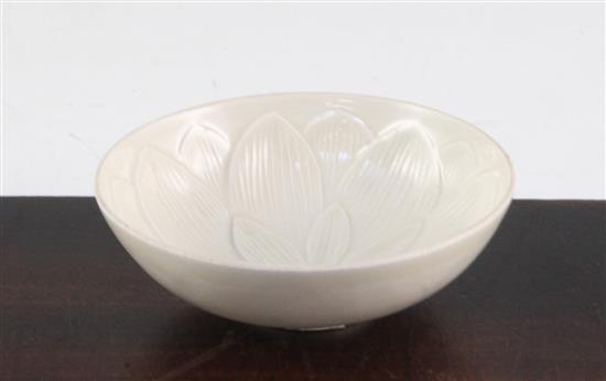 A Chinese Ding type flower moulded shallow bowl, 9.4cm